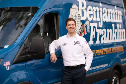 Benjamin Franklin Plumbing in Fort Myers Tech James in front of his van