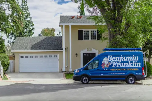 A Benjamin Franklin Plumbing Van outside a home in Fort Myers FL