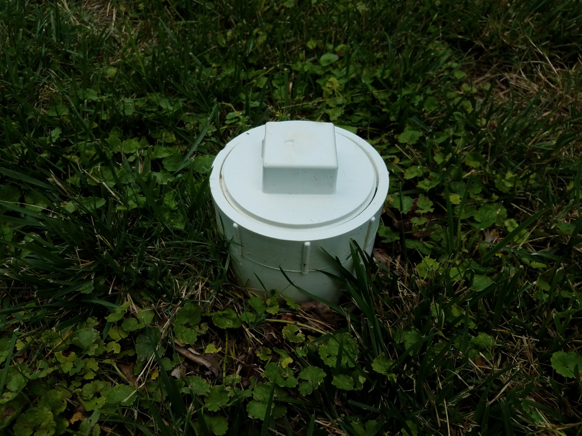 White sewer clean out