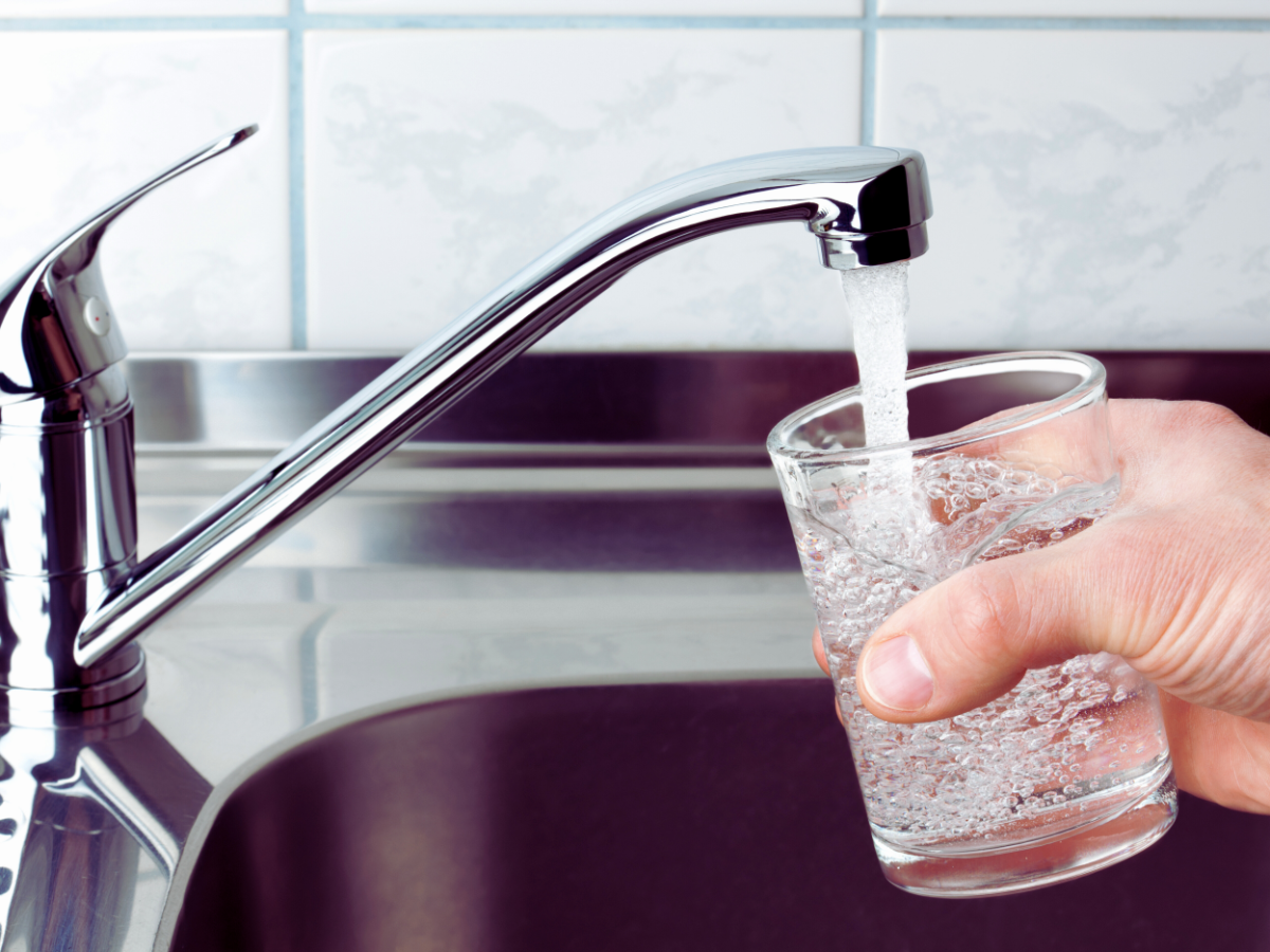 homeowner filling up glass with tap water 